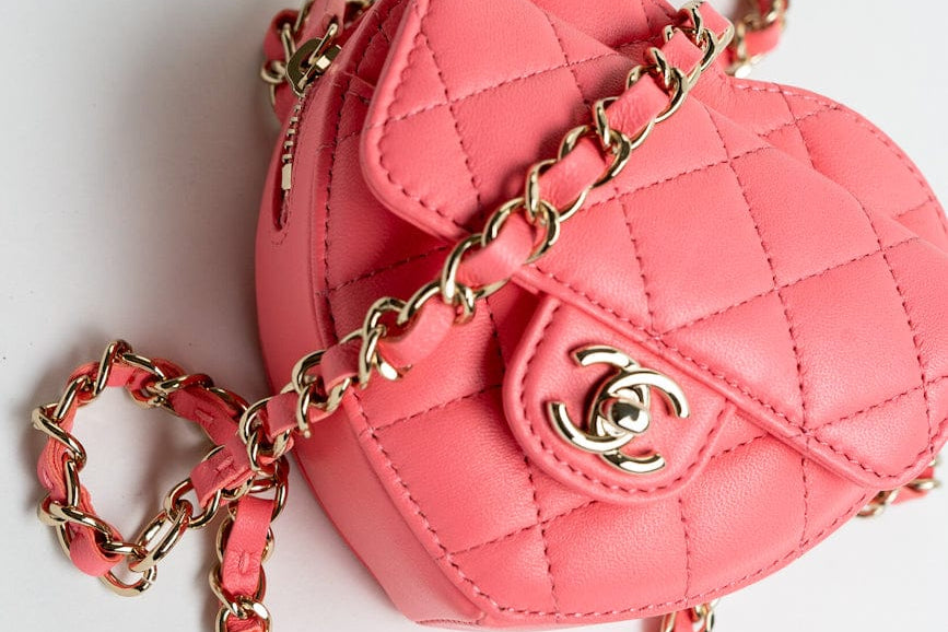 CHANEL Belt Bag Pink 22S CC In Love Heart Zipped Pink Lambskin Quilted Belt Bag LGHW - Redeluxe