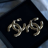 CHANEL Earrings 22C CC Earrings Light Gold - Redeluxe