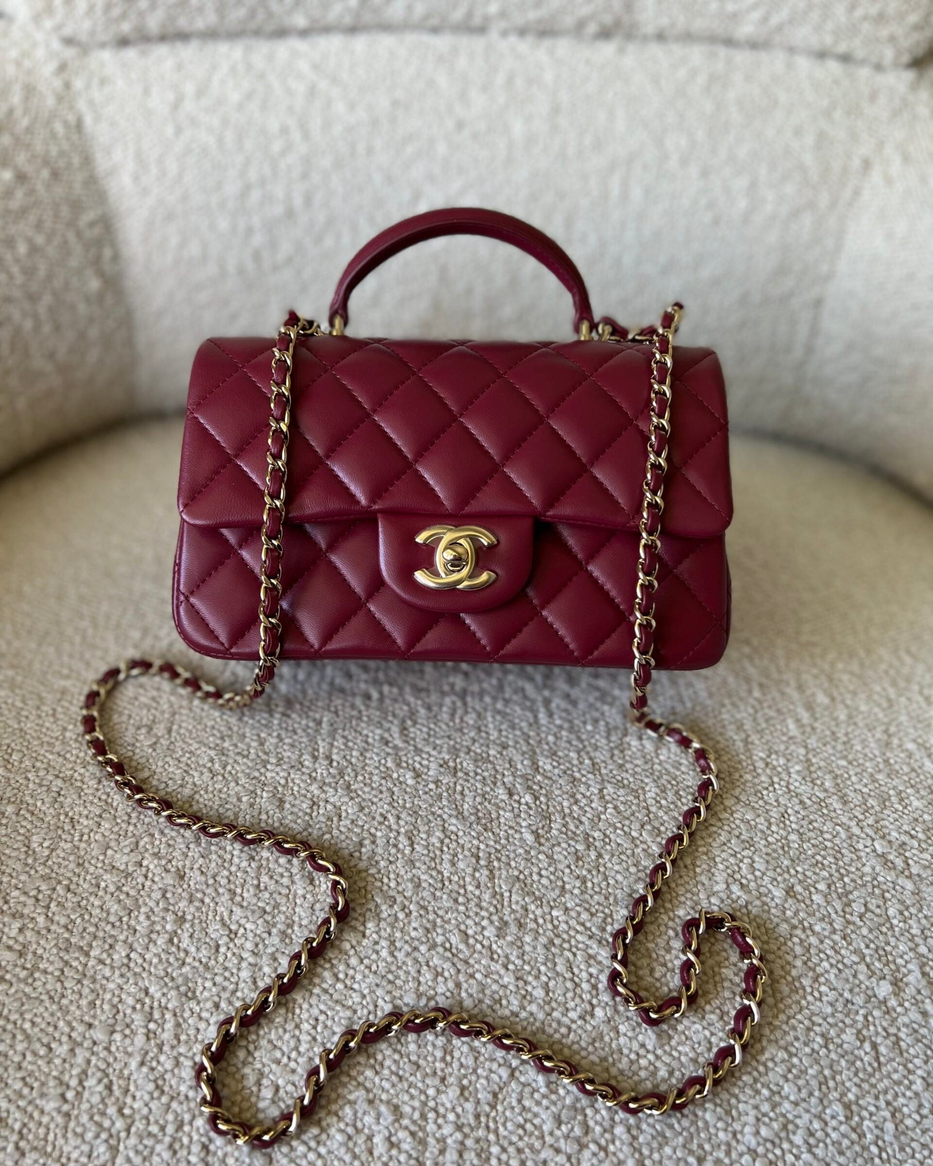 CHANEL Handbag 22A Mini Burgundy Lambskin Quilted Single Flap with Top handle Light Gold Hardware - Redeluxe