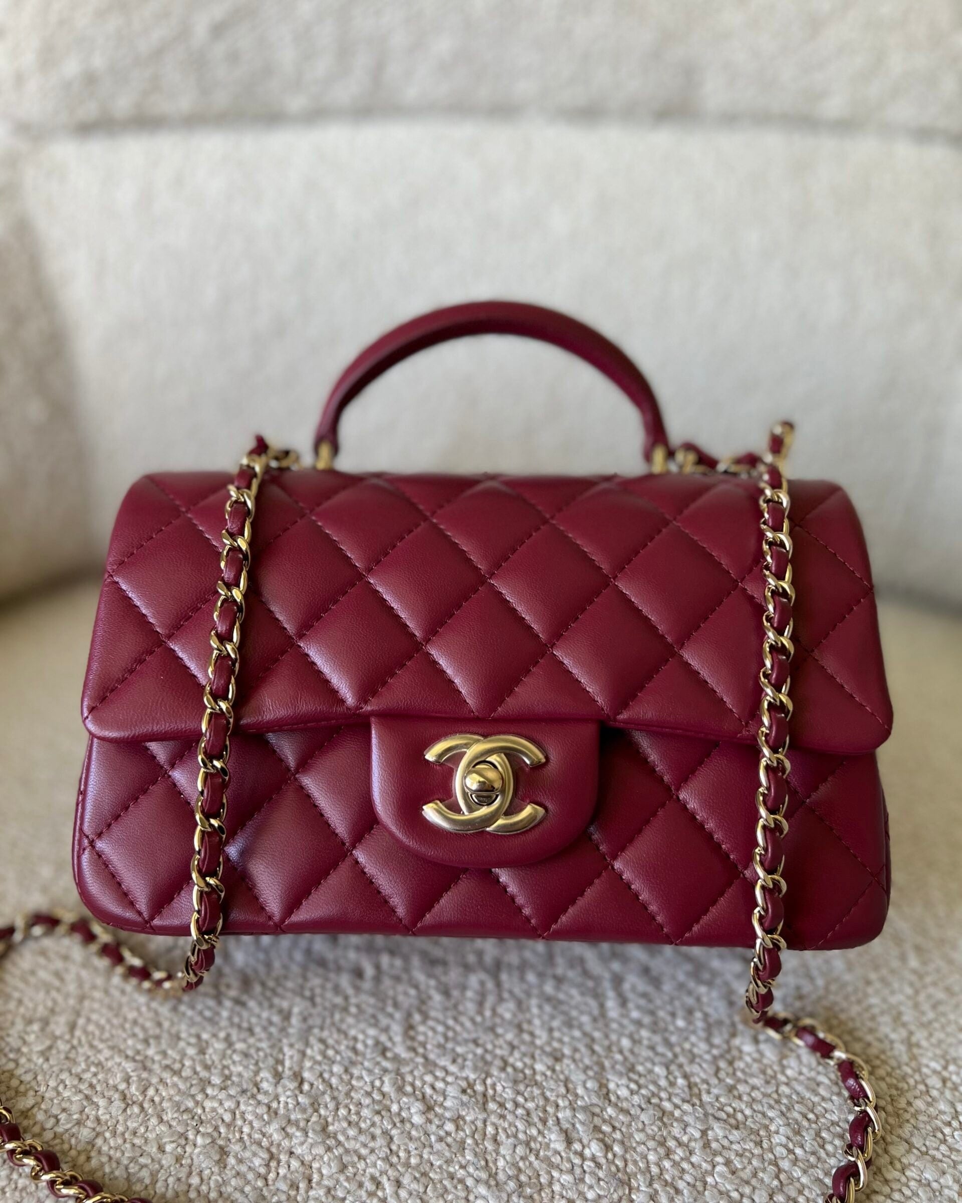 CHANEL Handbag 22A Mini Burgundy Lambskin Quilted Single Flap with Top handle Light Gold Hardware - Redeluxe