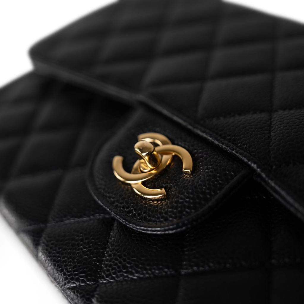 CHANEL Handbag Black Black Caviar Quilted Jumbo Classic Flap Gold Hardware - Redeluxe