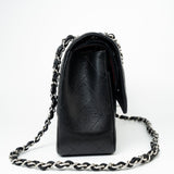 CHANEL Handbag Black Jumbo Caviar Quilted Classic Flap Silver Hardware - Redeluxe