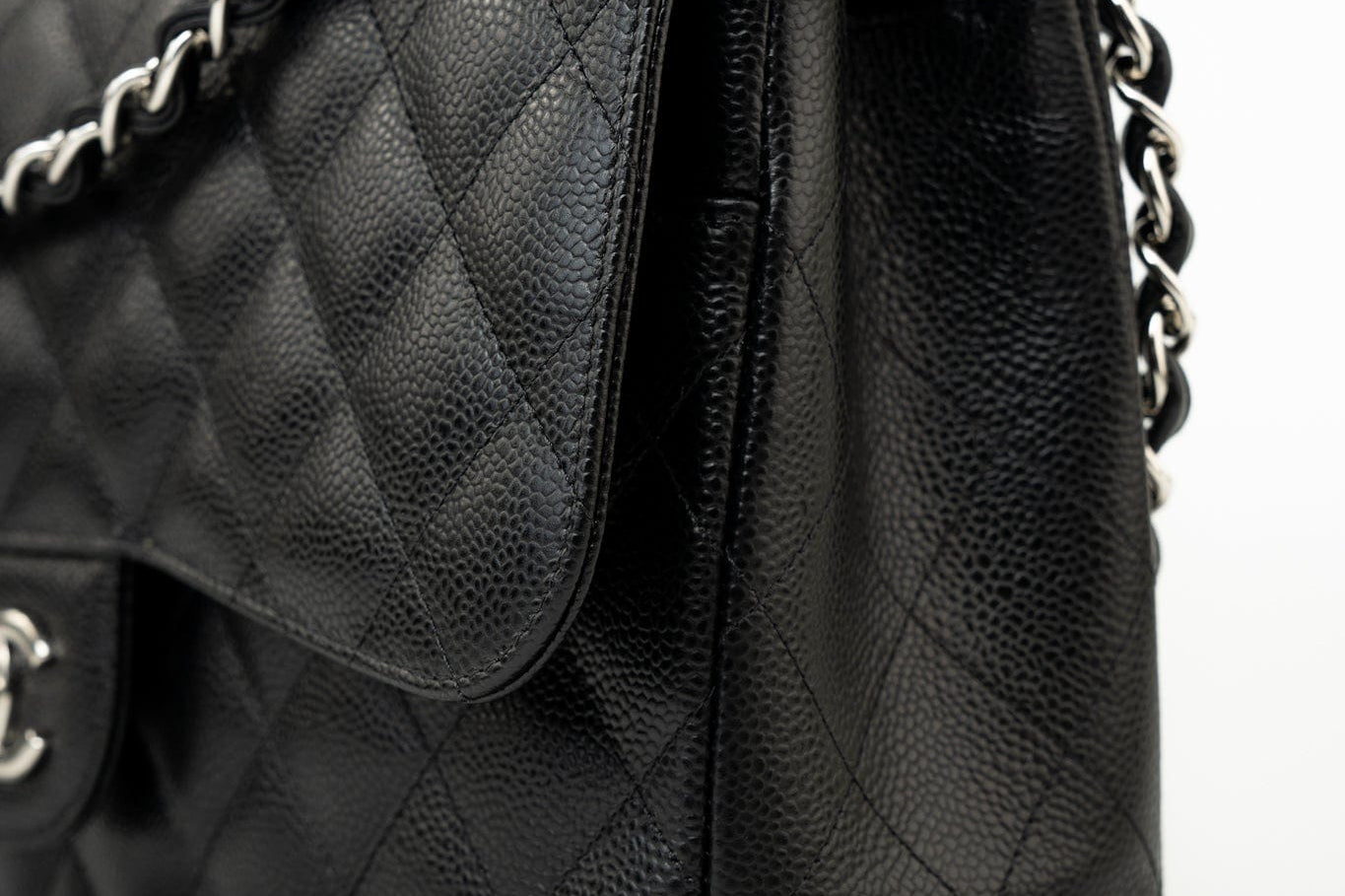 CHANEL Handbag Black Jumbo Caviar Quilted Classic Flap Silver Hardware - Redeluxe