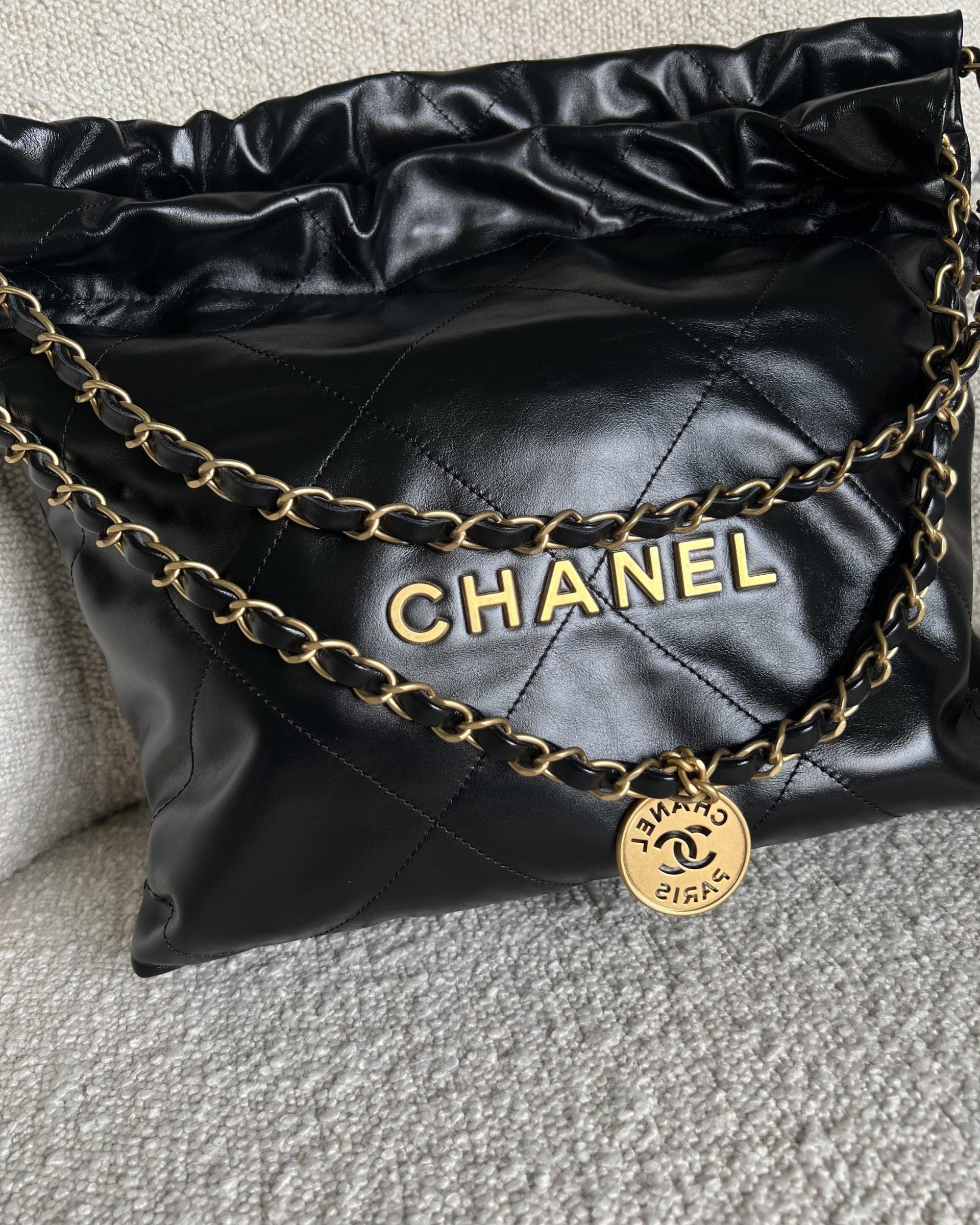 CHANEL Handbag Chanel 22 Shiny Calfskin Quilted Drawstring Bag GHW - Redeluxe