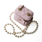 CHANEL Handbag Pink Light Pink Lambskin Quilted Mini Vanity Case With Pearl Chain - Redeluxe