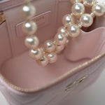 CHANEL Handbag Pink Light Pink Lambskin Quilted Mini Vanity Case With Pearl Chain - Redeluxe